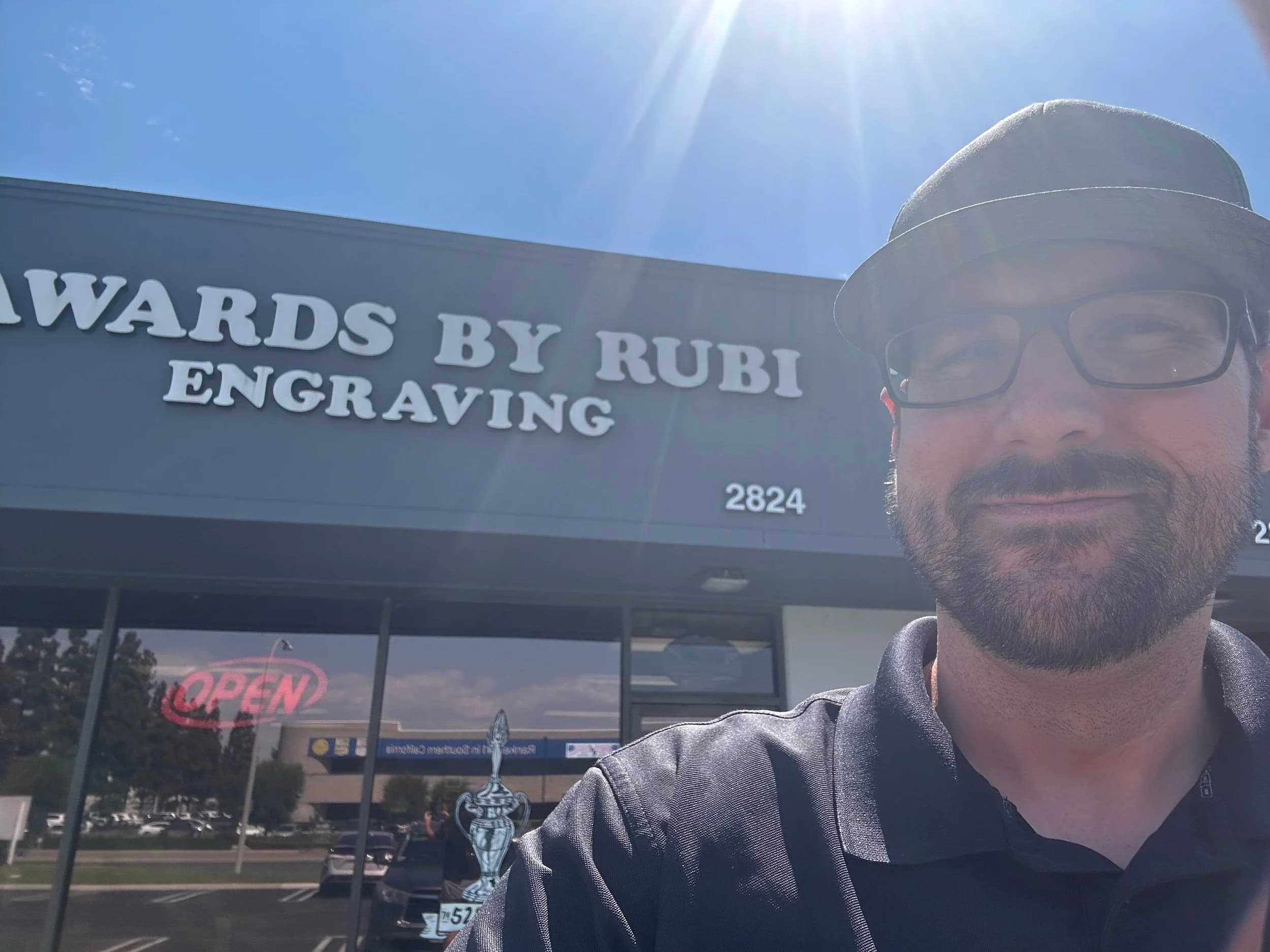 Chris Baarstad in front of Awards by Rubi Engraving shop